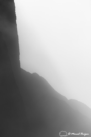 Cliffs in morning fog above Yellowstone River at Tower Falls, Wy