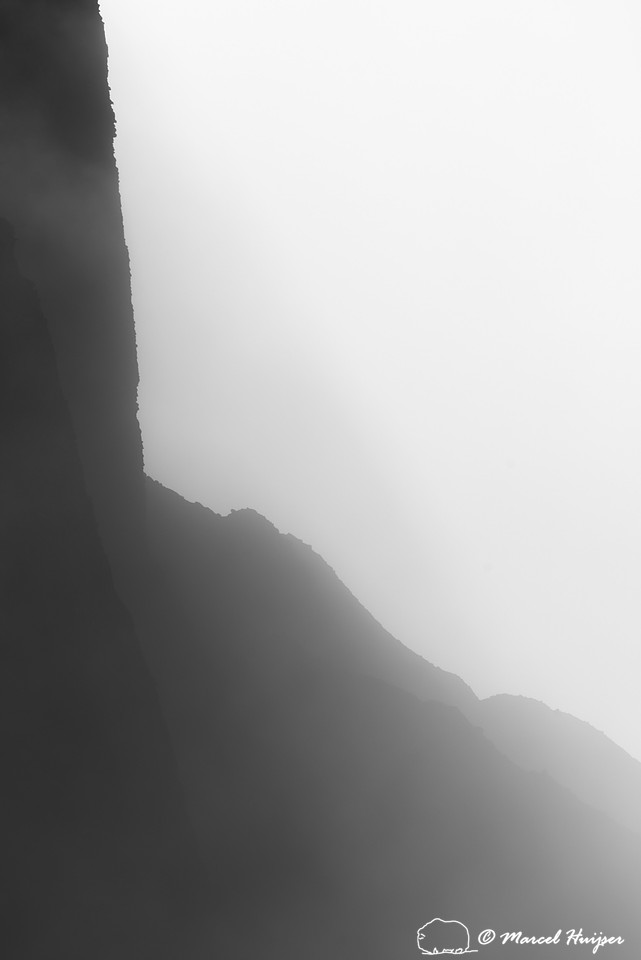 Cliffs in morning fog above Yellowstone River at Tower Falls, Wy