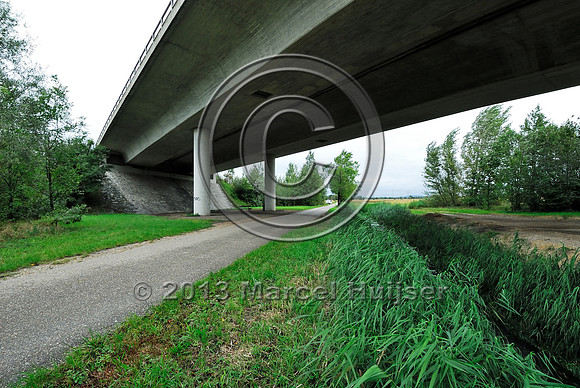 Farm road, ditch and bike pedestrian pathway, multifunctional underpass, across A4 motorway, Parndorf, Austria.