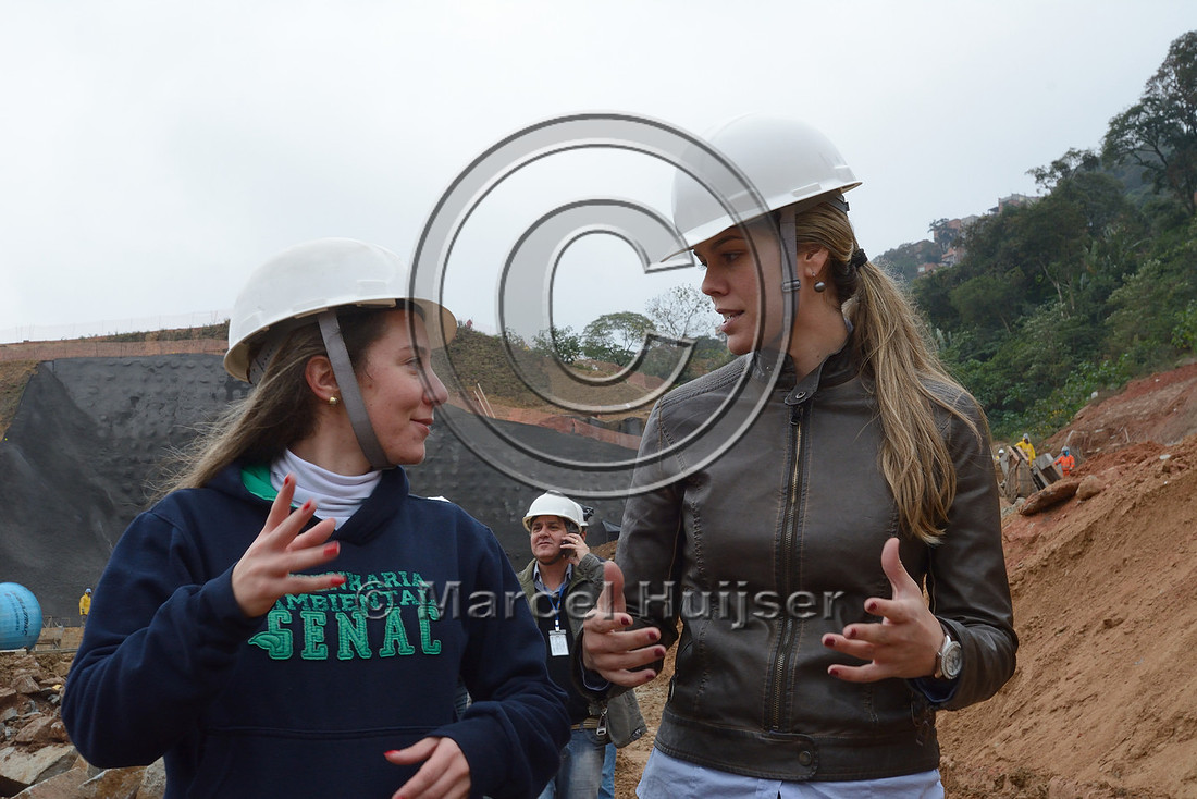 Jamille Consulin and Fernanda Abra at construction site of the northern outer beltway (Rodoanel Norte) through former favela (slums), São Paulo, Brazil