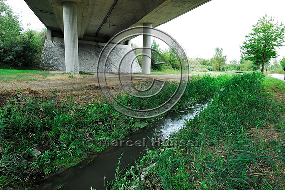 Farm road, ditch and bike pedestrian pathway, multifunctional underpass, across A4 motorway, Parndorf, Austria.
