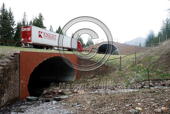 Wildlife underpass (foreground) and overpass (background), Flathead Indian Reservation, near Evaro, Montana, USA