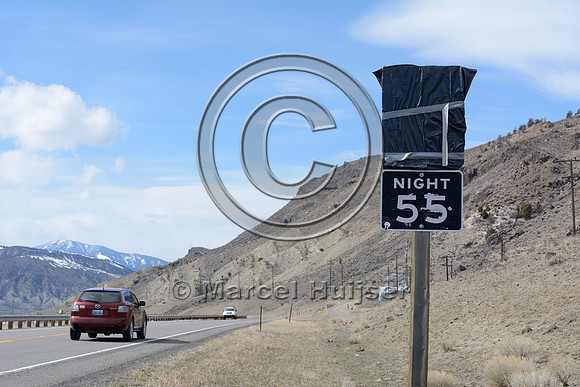 Posted speed limit reduced to 55 miles per hour (day and night) in response to bison in the area during late winter and early spring, US Hwy 89, north of Gardiner, Montana, USA