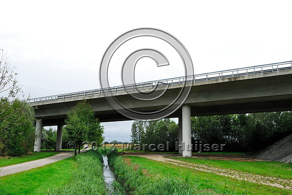 Farm road, ditch and bike pedestrian pathway, multifunctional underpass, across A4 motorway, Parndorf, Austria.