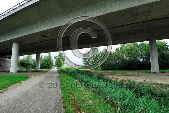 Farm road, ditch and bike pedestrian pathway, multifunctional underpass, across A4 motorway, Parndorf, Austria.