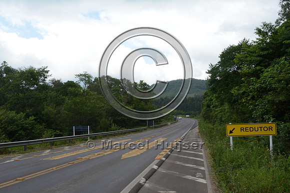 Rumble strip with limited smooth surface for the vehicle tires designed to reduce vehicle speed, RS-486, Reserva Biológica Mata Paludosa, Rio Grande do Sul, Brazil