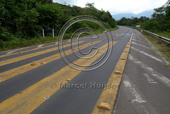 Rumble strip with limited smooth surface for the vehicle tires designed to reduce vehicle speed, RS-486, Reserva Biológica Mata Paludosa, Rio Grande do Sul, Brazil