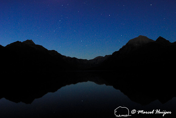 Starry night over mountain lake, Montana, USA
