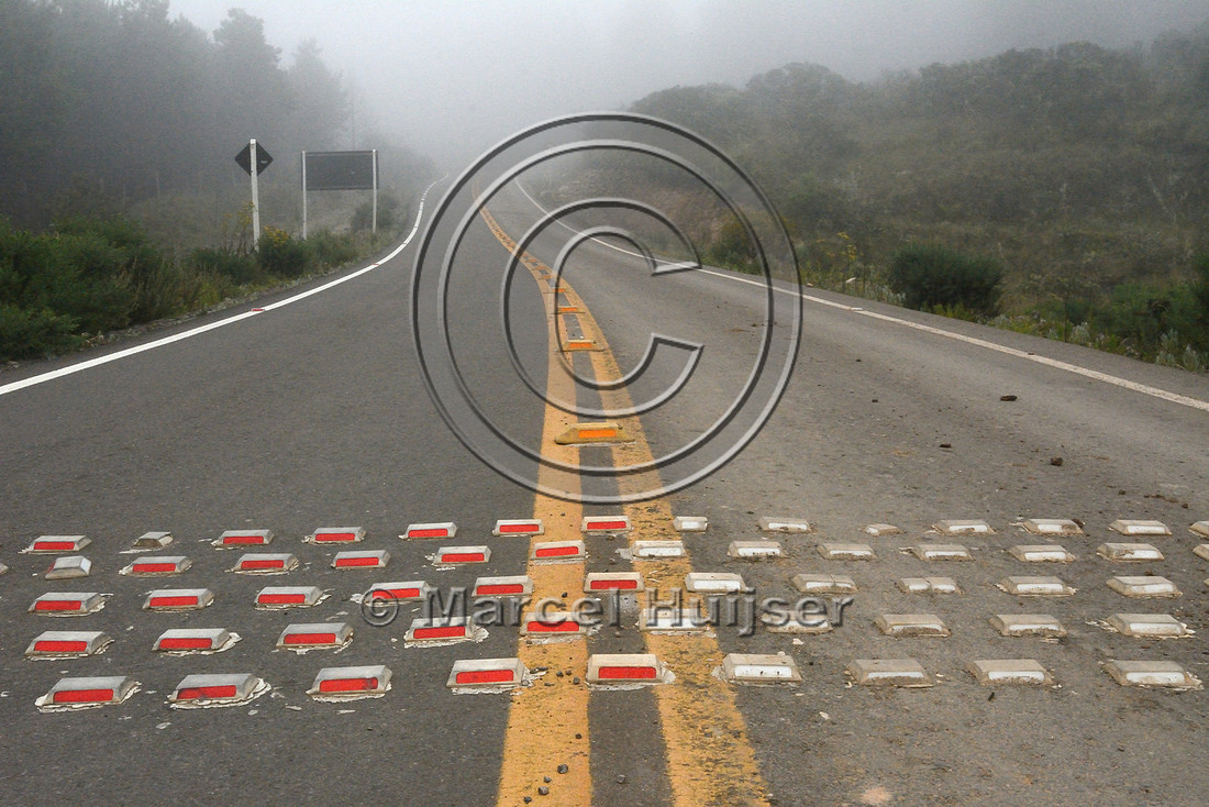 Speed bump intended to reduce vehicle speed on a road through a nature reserve, Parque Nacional de Aparados da Serra, east of Cambará do Sul, Rio Grande do Sul, Brazil