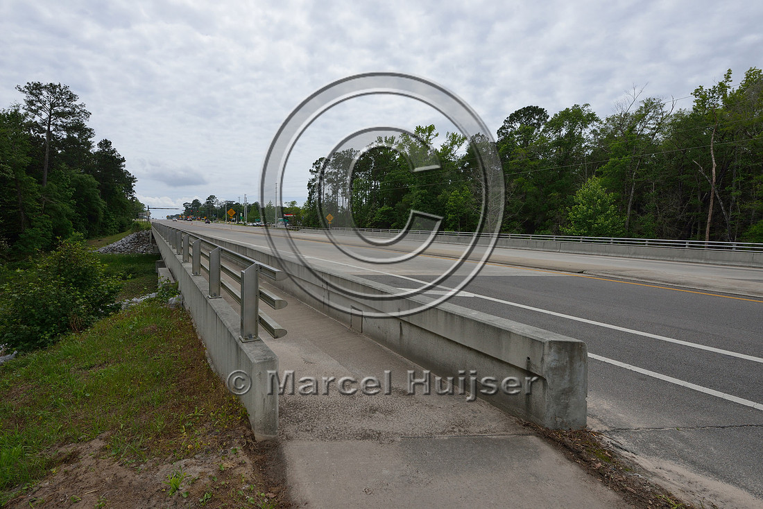 Bike and pedestrian path over multifunctional underpass (about 56 m wide for water and wildlife), Hwy 331, Hwy 83 near Freeport, Florida, USA