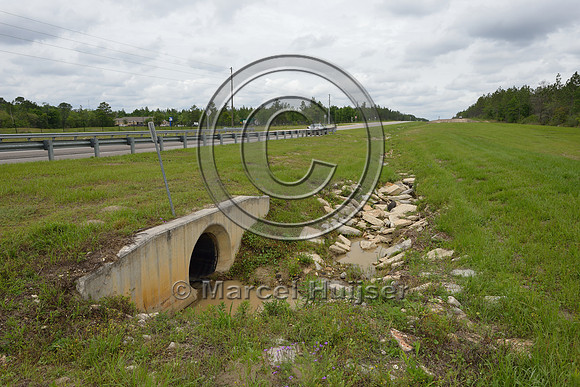 Drainage culvert with riprap to reduce erosion, Hwy 331, Hwy 83 near Freeport, Florida, USA