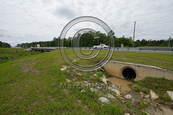 Drainage culvert with riprap to reduce erosion, Hwy 331, Hwy 83 near Freeport, Florida, USA