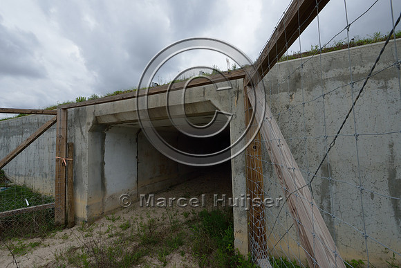 Wildlife fence (smaller mesh size towards bottom) funnels wildlife towards wildlife underpass, Hwy 331, Hwy 83 near Freeport, Florida, USA