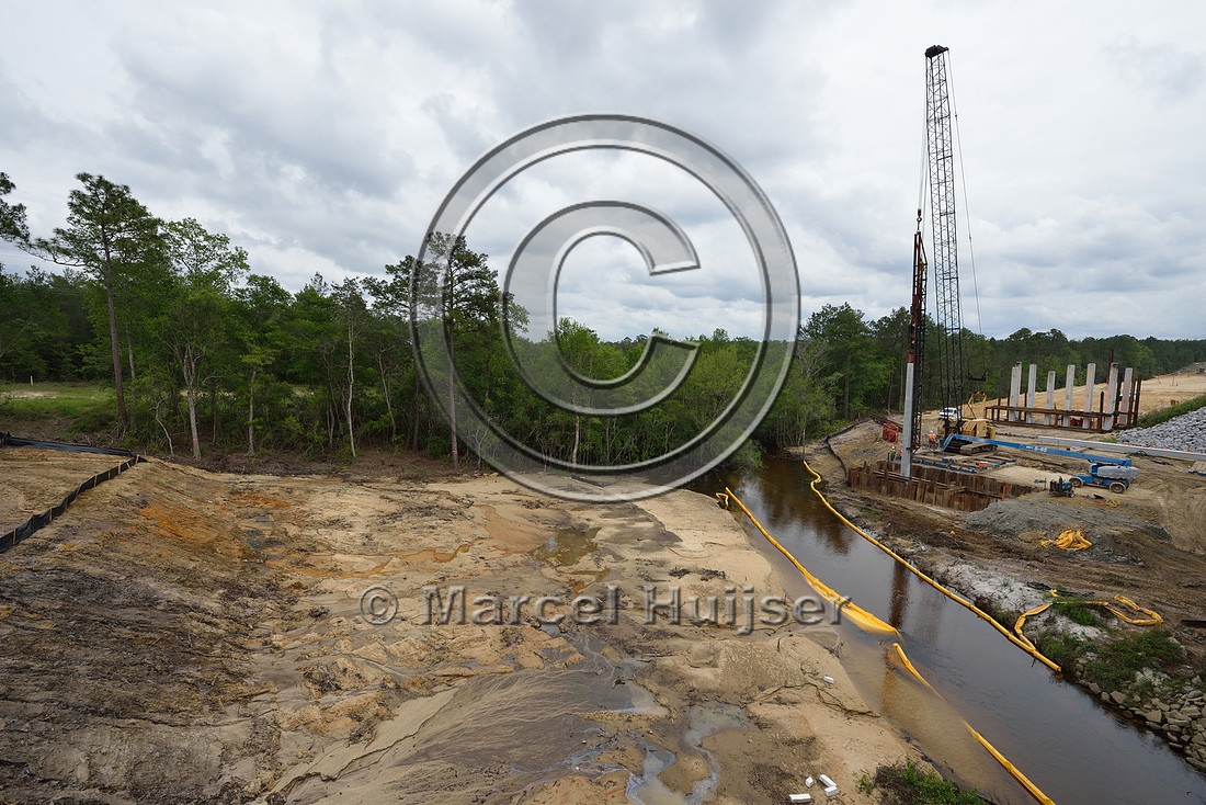 Erosion control at stream at construction of new bridge in association with highway widening (4 lanes to 2 lanes), Hwy 331, Hwy 83 near Freeport, Florida, USA