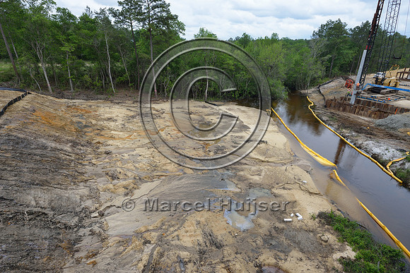 Erosion control at stream at construction of new bridge in association with highway widening (4 lanes to 2 lanes), Hwy 331, Hwy 83 near Freeport, Florida, USA