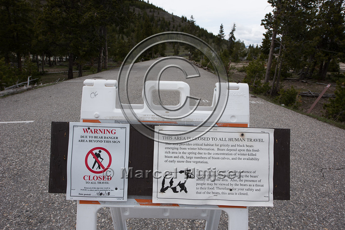 Sign, area closed to all human travel to reduce conflict with g