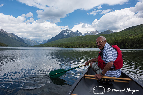Piet Huijser paddles a canoe, Bowman Lake, Glacier National Park