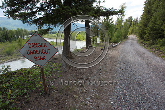 The North Fork of the Flathead river erodes river bank and adjac