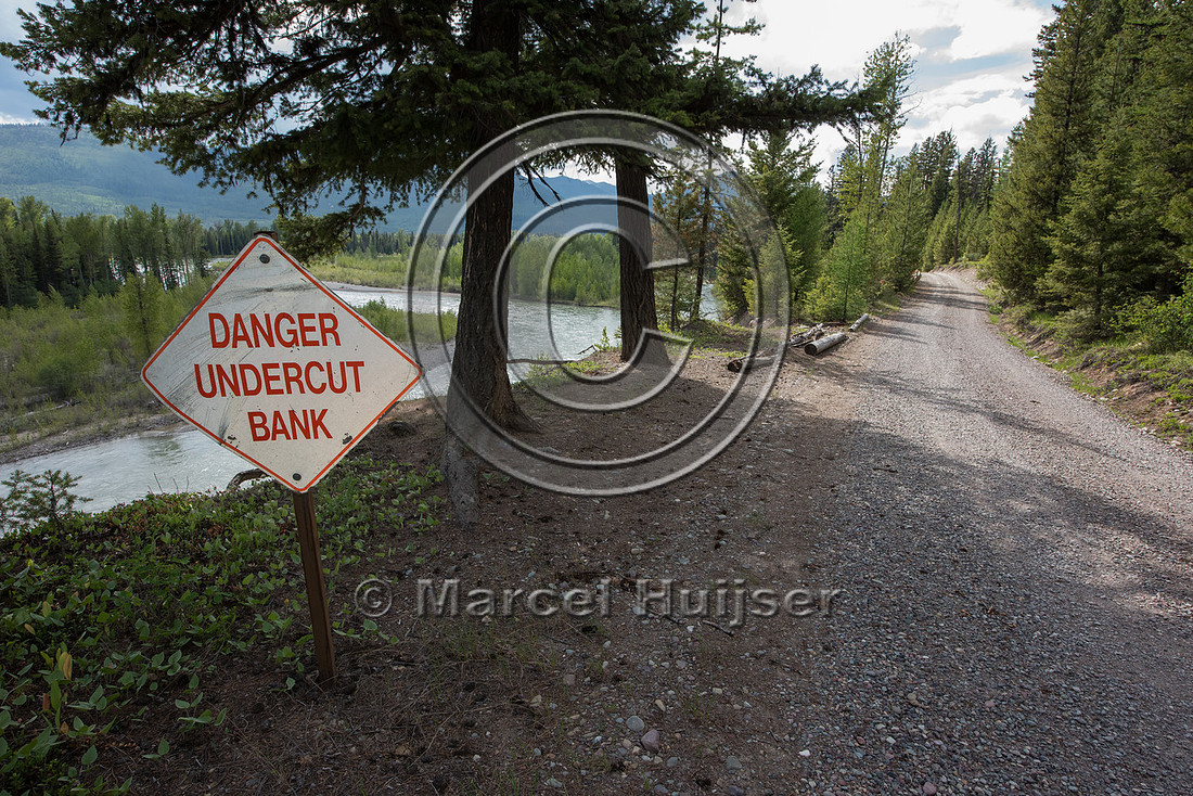 The North Fork of the Flathead river erodes river bank and adjac