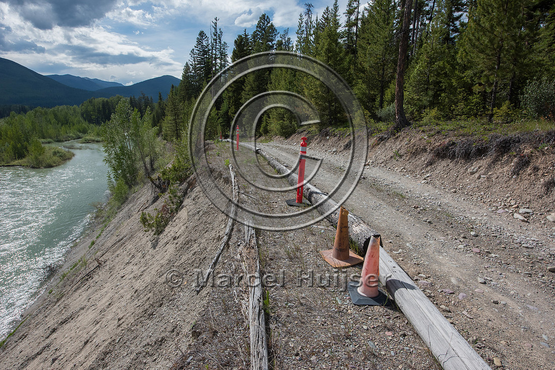The North Fork of the Flathead river erodes river bank and adjac