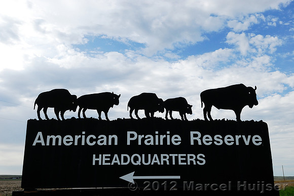 Road sign American Prairie Reserve Headquarters, Buffalo camp 5 mi, near Sun Prairie, Montana, USA