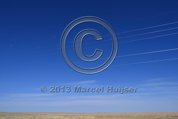 Power lines with markers for birds to reduce bird strikes, between Hanbogd and Oyu Tolgoi, near Hanbogd, Ömnögovi, Mongolia