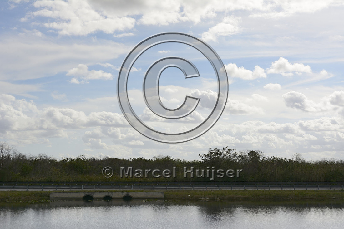 Culverts under unmitigated section of the Tamiami Trail (US Hwy 41) concentrating water flow in this section of the Everglades ecosystem, near Shark Valley, Florida, USA