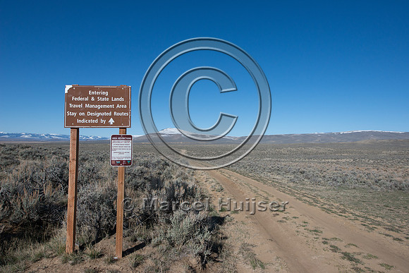 Sign, seasonal closure of dirt road to motorized vehicles to pro