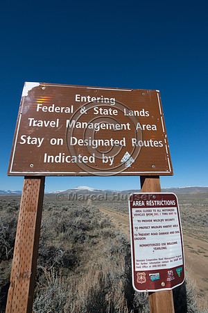 Sign, seasonal closure of dirt road to motorized vehicles to pro