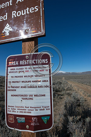 Sign, seasonal closure of dirt road to motorized vehicles to pro