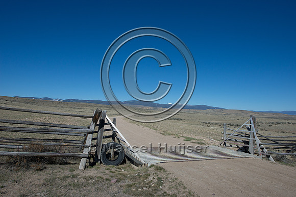 Cattle guard on gravel road, Montana, USA