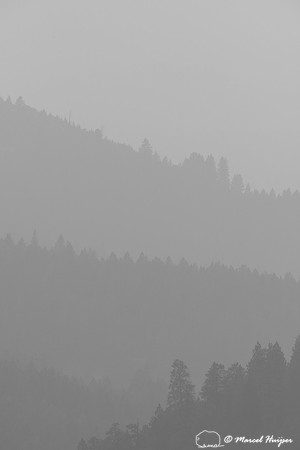 Forested ridges and smoky skies, Missoula, Montana, USA