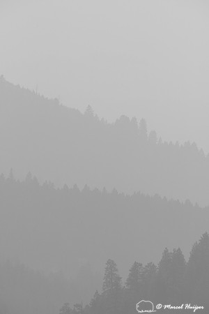 Forested ridges and smoky skies, Missoula, Montana, USA