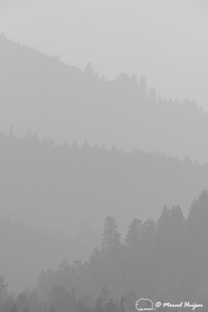 Forested ridges and smoky skies, Missoula, Montana, USA