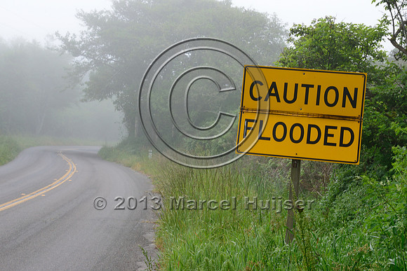 Warning sign, caution, flooded road, Point Reyes National Seashore, California, USA
