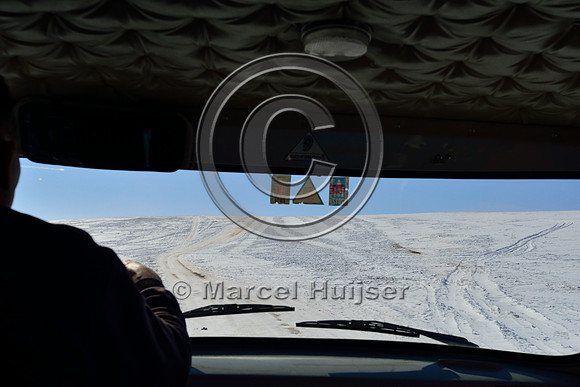 Parallel dirt road (parallel two tracks) on snow covered grasslands, near Bayan-Adarga, Khentii, Mongolia