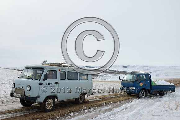 Helping another vehicle get out of a snow bank, near Bayan-Adarga, Khentii, Mongolia