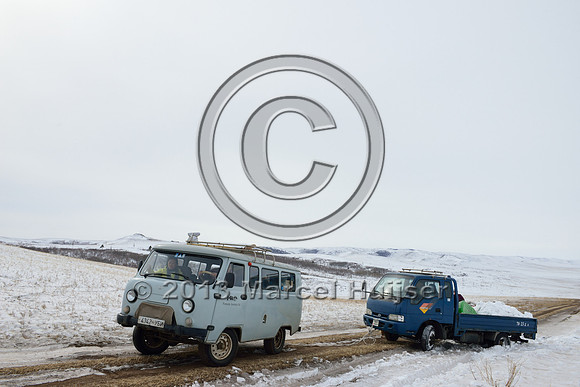 Helping another vehicle get out of a snow bank, near Bayan-Adarga, Khentii, Mongolia