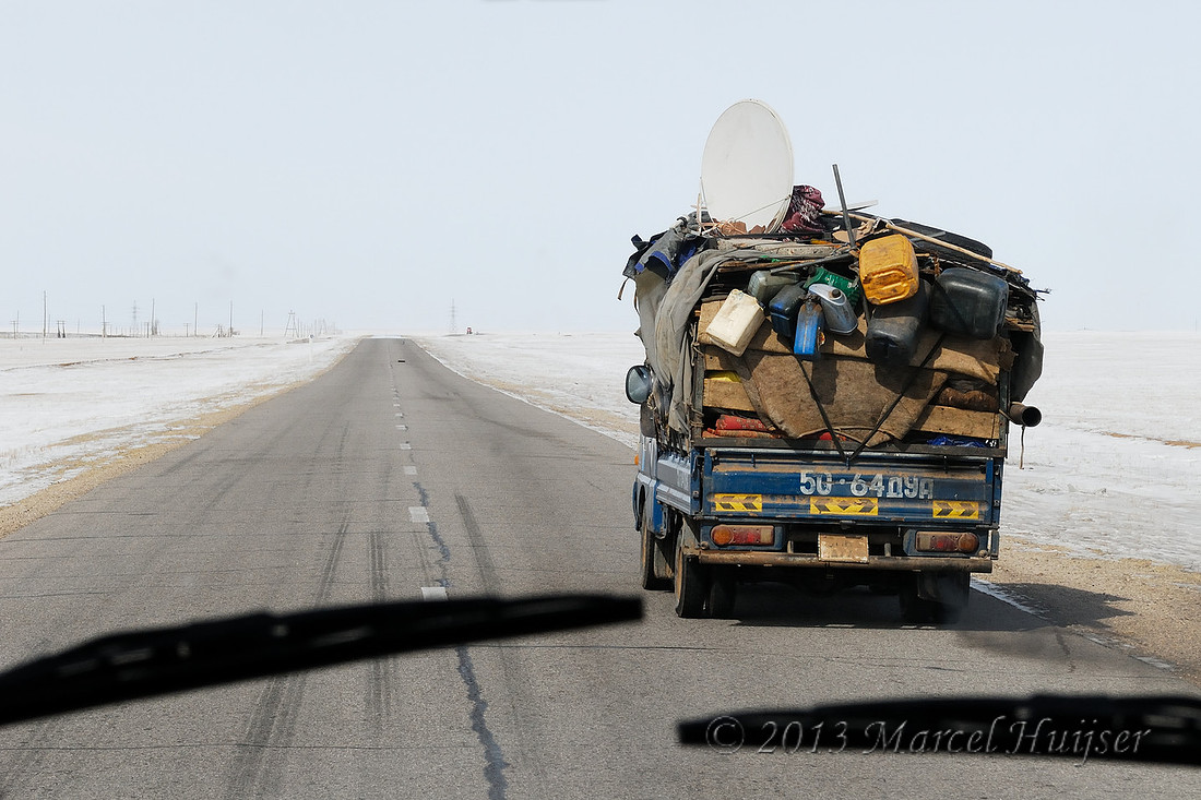 Travel: Loaded truck along A0101 paralleling Trans-Mongolian Railway, between Choyr and Nalayh, Töv Govisümber, Mongolia