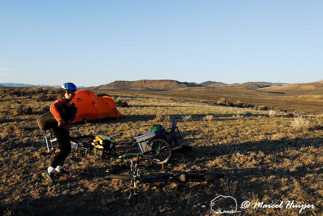 Emiliano Ferguson setting up camp near a sage grouse (Centrocercus urophasianus) lek, Montana, USA