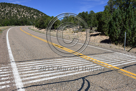 Painted stripes on pavement as a virtual cattle guard, Hwy 89A, east of Jacob Lake, Arizona, USA