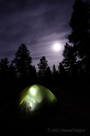 Illuminated tent with moonlit sky, Arizona, USA