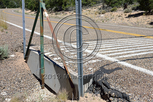 Painted stripes on pavement as a virtual cattle guard, Hwy 89A, east of Jacob Lake, Arizona, USA