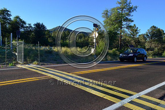 Electric mat associated with an animal detection and driver warning system at a fence end, S.R. 260 east of Payson, Arizona, USA