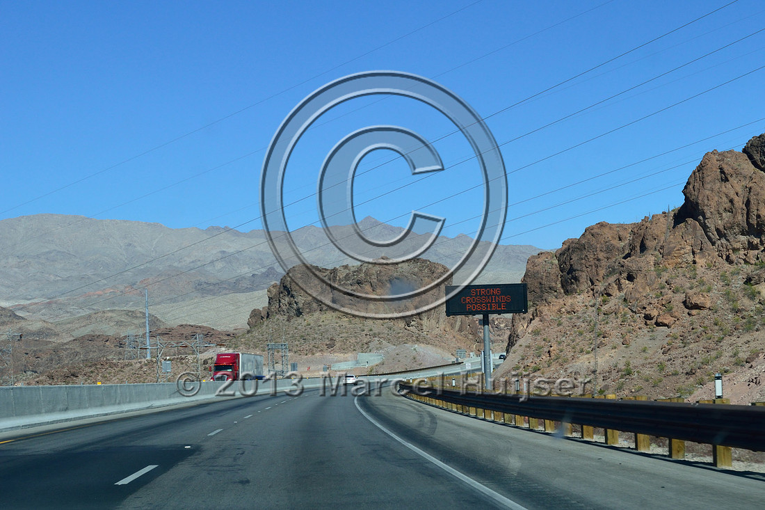 Road ecology blog: Warning sign, Strong winds possible, high profile vehicles left lane next mile, US Hwy 93, Hoover dam bypass, bridge across Colorado River, Nevada, USA