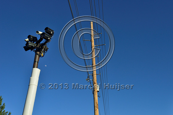 Detection area with sensors and cameras associated with an animal detection and driver warning system at a fence end, S.R. 260 east of Payson, Arizona, USA