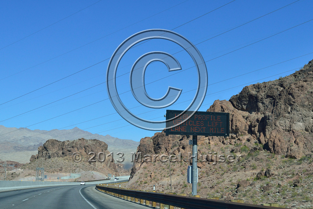 Road ecology blog: Warning sign, Strong winds possible, high profile vehicles left lane next mile, US Hwy 93, Hoover dam bypass, bridge across Colorado River, Nevada, USA