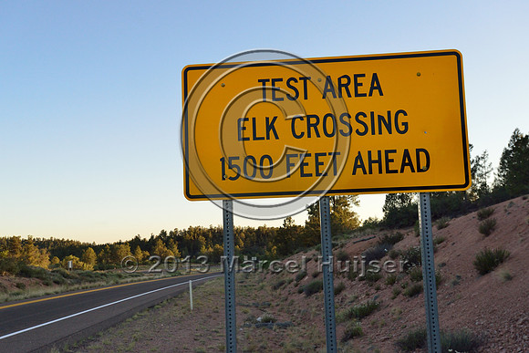 Sign, test area, elk crossing, 1500 feet ahead, animal detection and driver warning system, S.R. 260 east of Payson, Arizona, USA