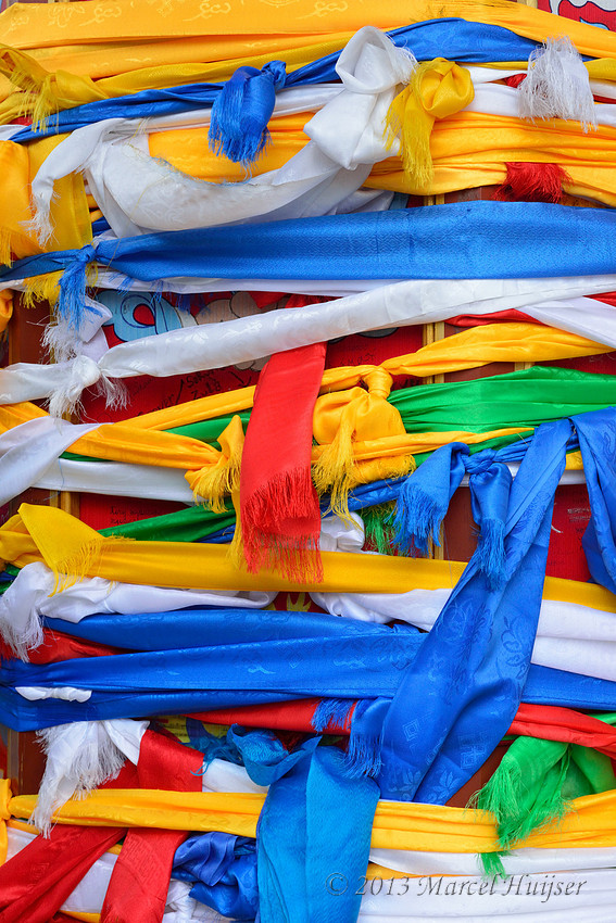 Travel: Prayer wheel covered in silk scarfs at the Gandantegchinlen Monastery, Ulaanbaatar, Mongolia
