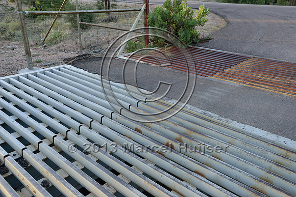 Double wide cattle guard as a barrier for deer (Odocoileus spp.) and elk (Cervus canadensis) at access road for NF 405A, at jct with SR 260, east of Payson, Arizona, USA